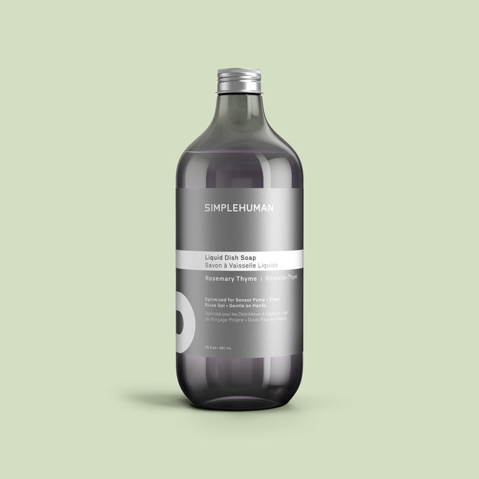 Simplehuman's Rosemary Thyme Liquid Dish Soap Refill Bottle on a colored background.