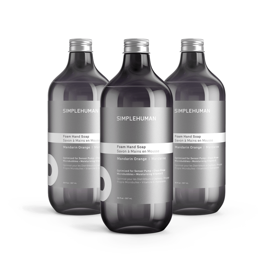 Simplehuman's Mandarin Orange Foaming Hand Soap in 3 charcoal colored bottles and titanium caps.