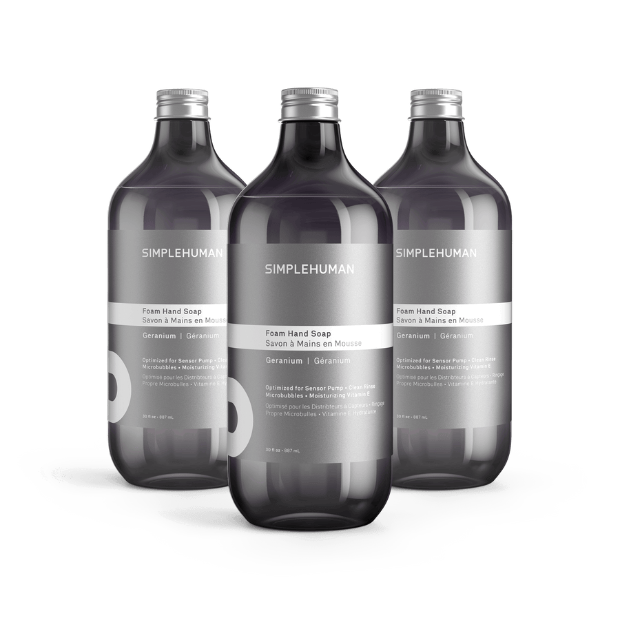 Simplehuman's Geranium Foaming Hand Soap in 3 charcoal colored bottles and titanium caps.