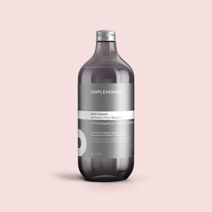 Simplehuman's Citrus Grapefruit Bath Cleaner Refill Bottle on a colored background.