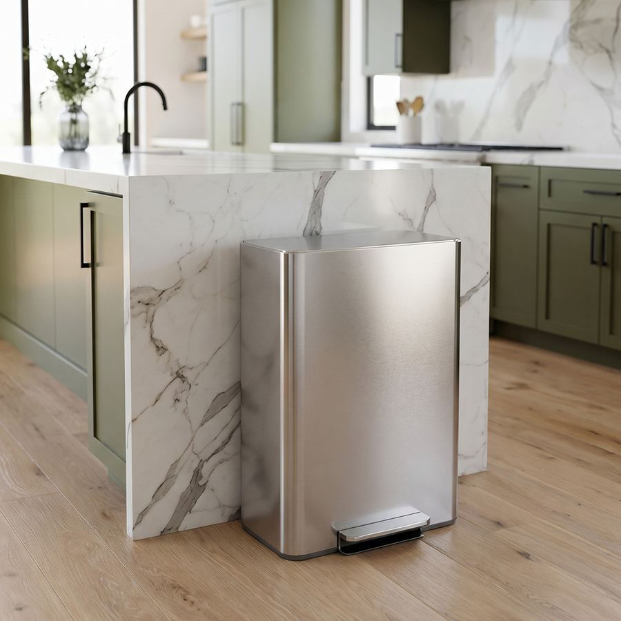 Simplehuman's Brushed 30L Step Recycler, in a modern kitchen setting with marble countertops and green cabinets. 