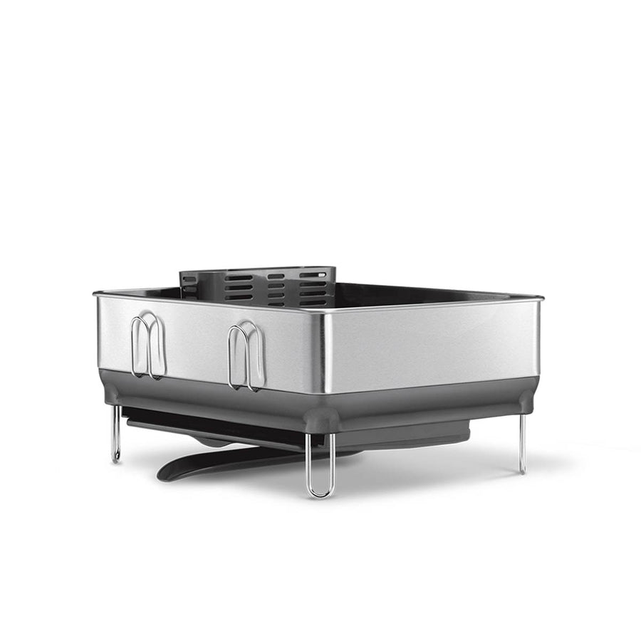 Angled view of Simplehuman Compact Steel Frame Dishrack in Brushed Stainless Steel, featuring pivoting drain spout.