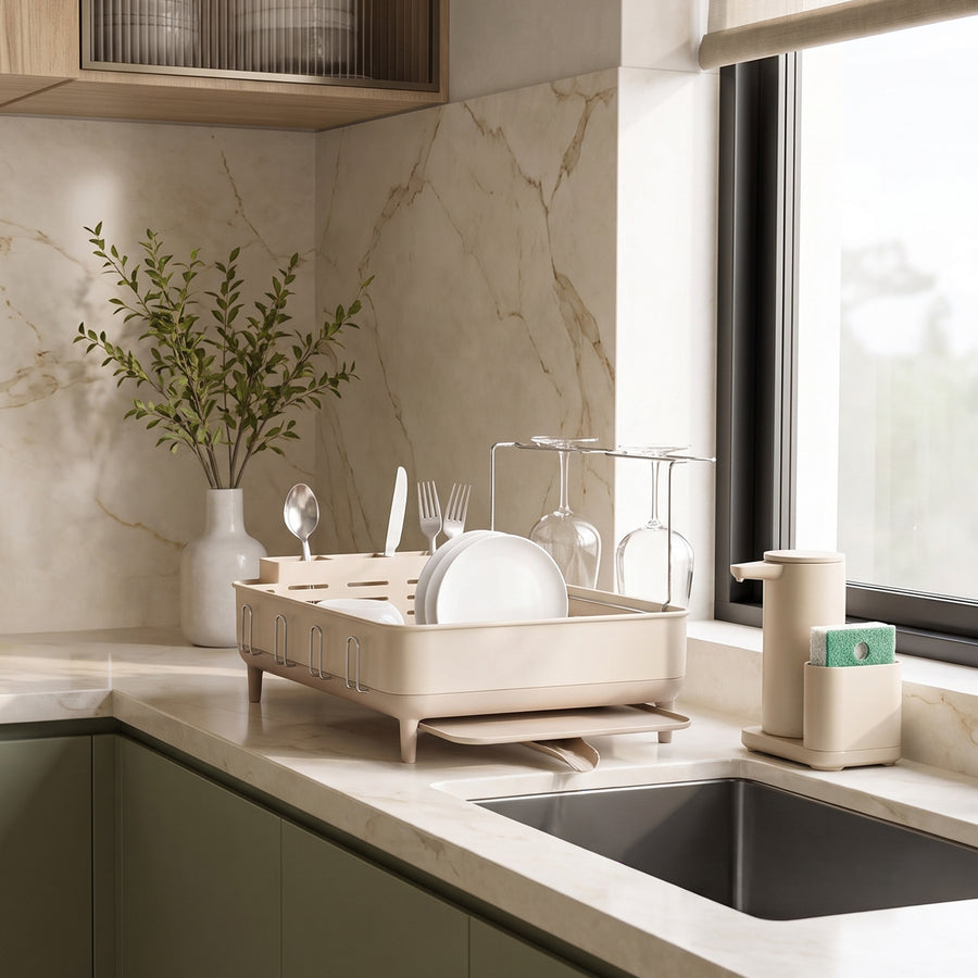 Simplehuman's Standard Dishrack in a Latte finish in a modern kitchen setting on a marble countertop. 