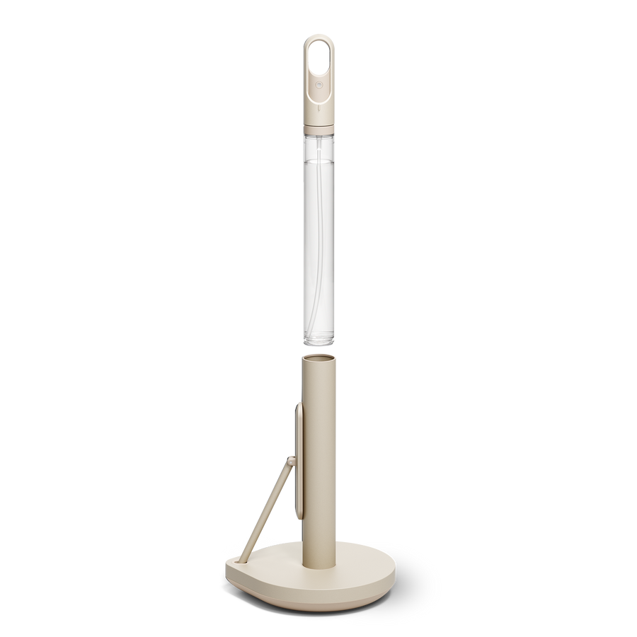 Simplehuman's Paper Towel Holder with Spray showcasing the pump being take out of the holder. 