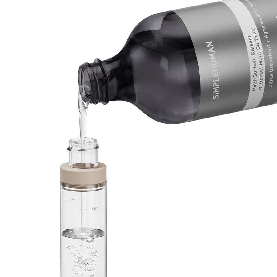 Simplehuman's Paper Towel Holder with Spray filling the pump with Multi-Surface Cleaner. 