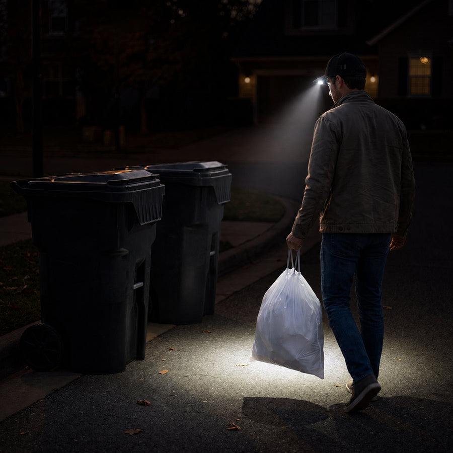 Simplehuman's LED Cap being used to take out the trash at night. 