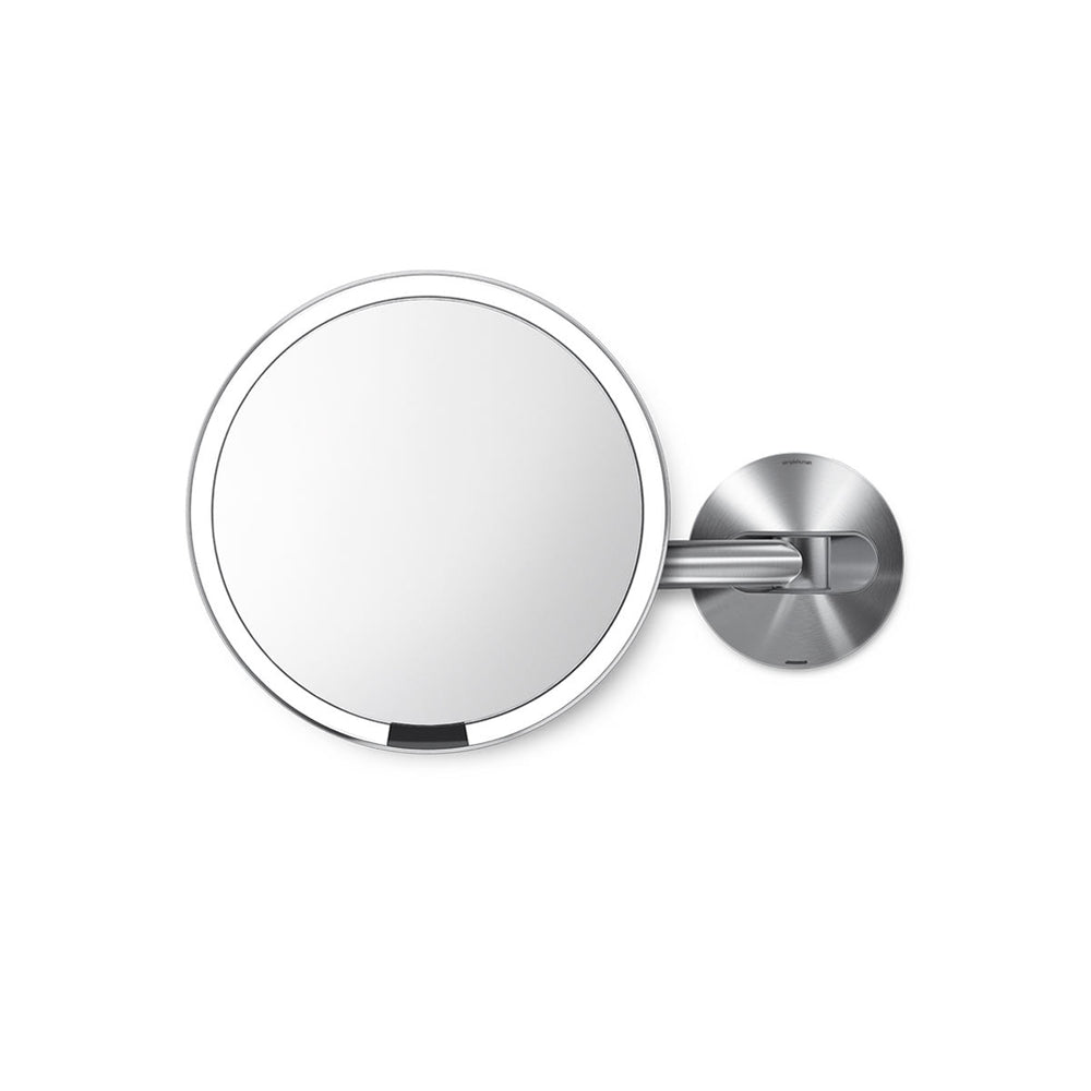 Simplehuman Rechargeable Wall Mount Sensor Mirror in Brushed Stainless Steel showing hands-free sensor light activation.
