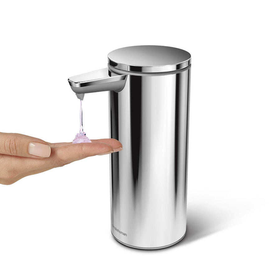 Angled view of Simplehuman 9 oz. Rechargeable Sensor Pump in Polished Stainless Steel dispensing soap, hands-free.