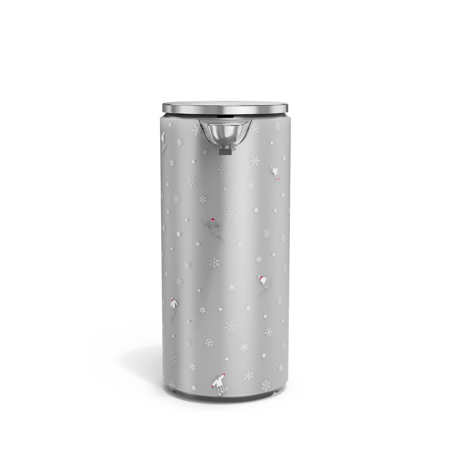 Front view of Simplehuman Brushed 14 oz. Sensor Pump with holiday sleeve. White, frosted sleeve with skiers and snowflakes. 