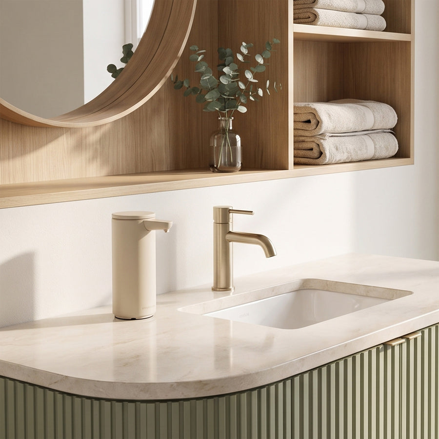 Simplehuman's Latte 9 oz. Sensor Pump in a modern kitchen setting on a marble countertop. 