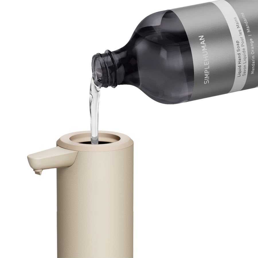 Simplehuman's 9 oz. Liquid Sensor Pump with Liquid Hand Soap pouring into the bottle. 