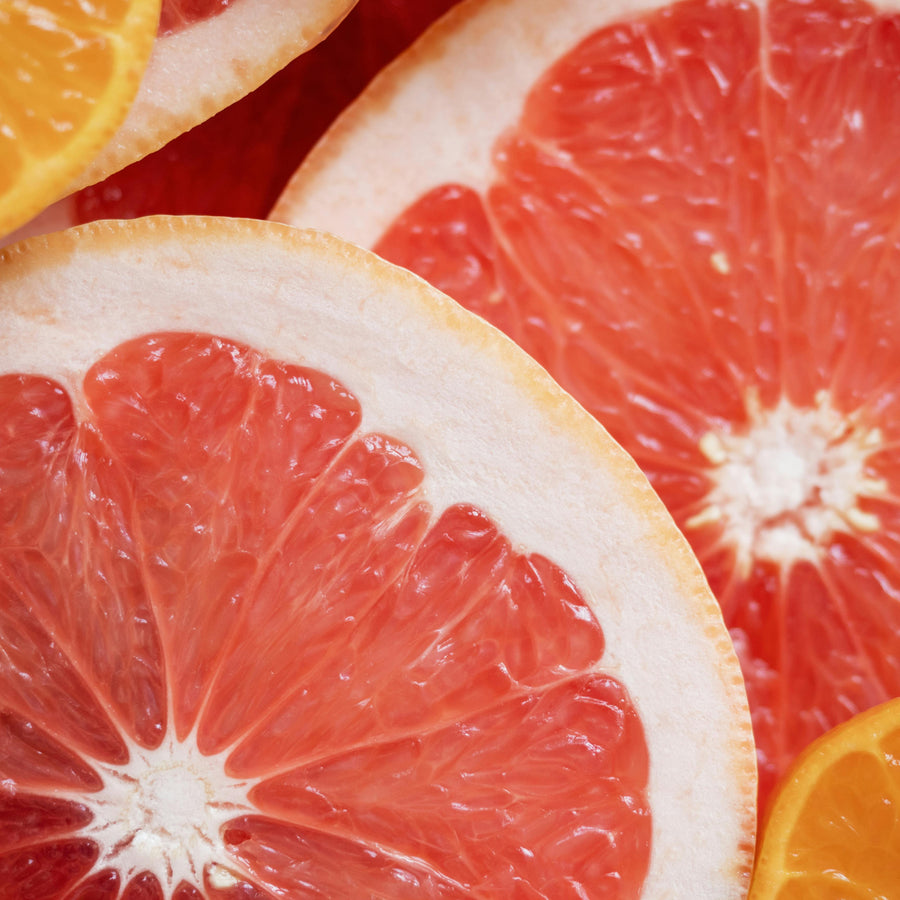 Close up of a grapefruit representing Simplehuman's Citrus Grapefruit scent.