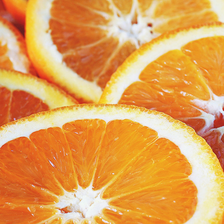 A close up of oranges representing Simplehuman's Mandarin Orange scent.